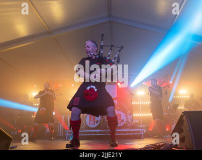 22 July 2022. Fochabers, Moray, Scotland. This is the Red Hot Chilli Pipers playing at the 2022 Speyfest on Friday night. Stock Photo