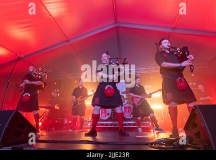 22 July 2022. Fochabers, Moray, Scotland. This is the Red Hot Chilli Pipers playing at the 2022 Speyfest on Friday night. Stock Photo