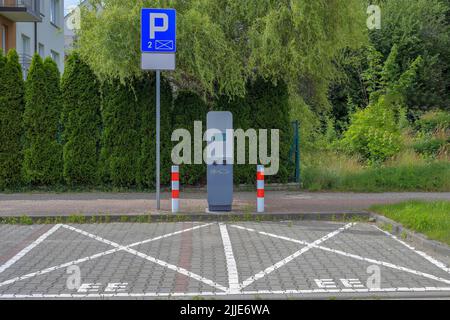 Electric vehicle charging station with two parking spaces in Koszalin, Poland Stock Photo