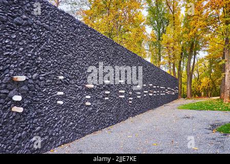 KYIV, UKRAINE - OCT 17, 2021: Explore the Crystal Wall of Wailing in Babyn Yar (Babi Yar) Holocaust Memorial Center, created of black coal and crystal Stock Photo