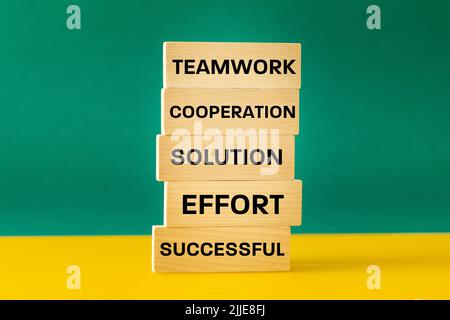 words written on a wooden block, teamwork, collaboration, solution, effort, success, creative business concept, brainstorming, common goal and project Stock Photo