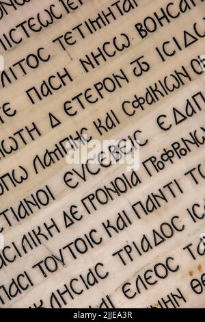 abstract of greek writing. greek language in abstract composition. greek literature written on a page close-up. Stock Photo
