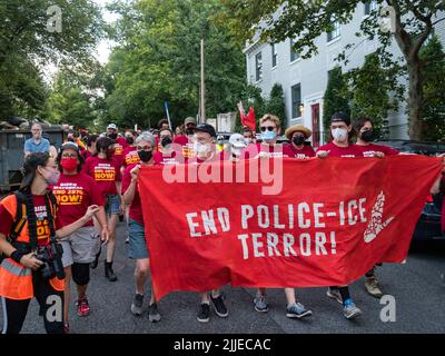 Washington, DC, USA, July 25, 2022, District of Columbia, USA: Activists demanding that President Biden keep his campaign promise to end 287(g) police-ICE contracts march through DCÃs Georgetown neighborhood. The collaboration of state and local law enforcement officers with the federal government to enforce federal immigration laws has resulted in mass deportations. (Credit Image: © Sue Dorfman/ZUMA Press Wire) Stock Photo