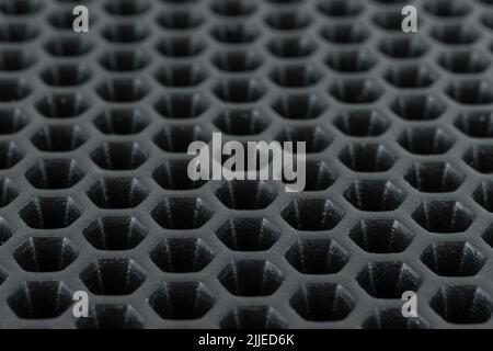 Black any panel honeycomb or channel rubber sheet background.Elastic and absorb weight.Made from rubber absorber.Shadow and gredient.View of copy spac Stock Photo