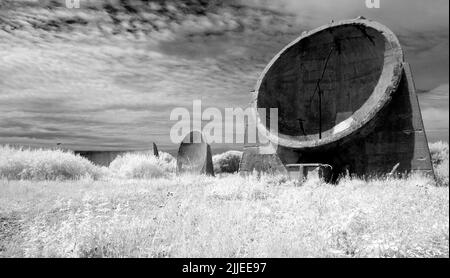 Infrared photo of the concrete sound mirrors at Lade Pits, part of RSPB Dungeness Nature Reserve, Kent, England. Stock Photo