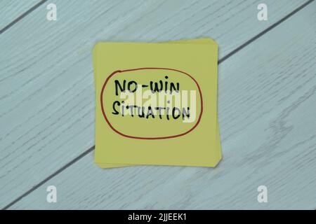 Concept of No-Win Situation write on sticky notes isolated on Wooden Table. Stock Photo