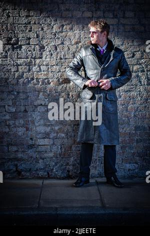 serious male undercover agent in sunglasses using talkie walkie near car  Stock Photo - Alamy