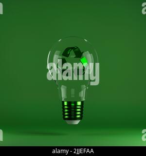 Recycling sign inside light bulb on green background. Concept of energy saving, eco-friendly technologies and sustainable lifestyle. Stock Photo