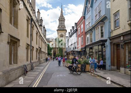 View down Turl Street tourists and buildings, with All Saints Church, Library of Lincoln College in background, Oxford Oxfordshire, UK Stock Photo