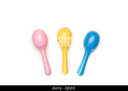 Three colored maracas on a white background with copy space Stock Photo