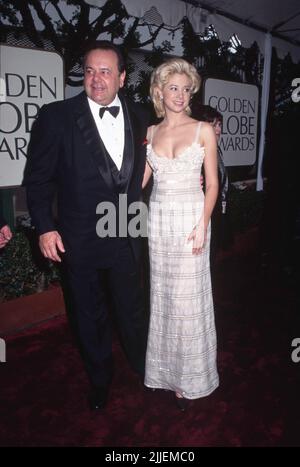 Beverly Hills, USA. 07th July, 2014. January 1996, Beverly Hills, California, USA --- Original caption: 1/1996-Los Angeles, CA: Paul Sorvino and his daughter Mira arrive at the Beverly Hilton Hotel for the Golden Globe Awards. Mira is wearing a low-cut white and silver dress. --- ' Tsuni/Bourquard 'Paul and Mira Sorvino Paul and Mira Sorvino Credit: Tsuni/USA/Alamy Live News Stock Photo