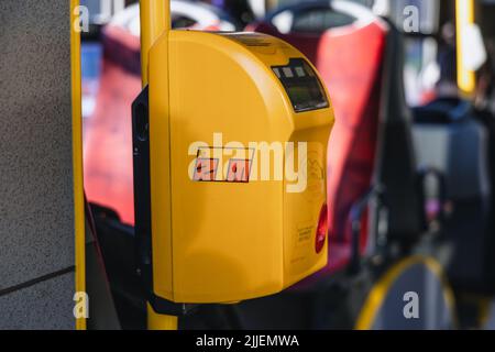 Ticket validating machine in a public bus in Warsaw, capital of Poland Stock Photo