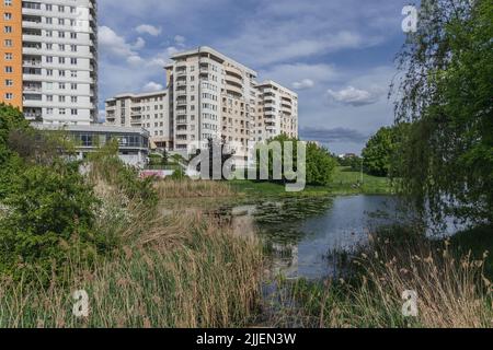 Residential buildings over Goclaw Lake in Goclaw area, Praga Poludnie district of Warsaw, capital of Poland Stock Photo