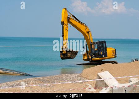 Excavator loading quarry truck dump tractor machinery machine loader heavy, from backhoe soil for dig and sky work, bucket crawler. Mud rotate yellow, Stock Photo