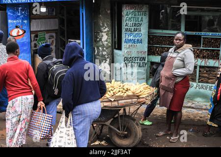 A woman seen selling bananas to locals in Kibera Slum. Street food 