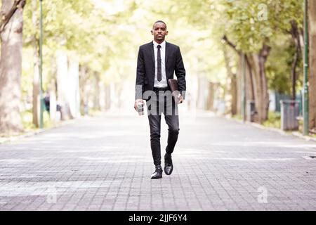 Enjoying his morning commute. Full length portrait of a handsome young businessman on his morning commute into work. Stock Photo