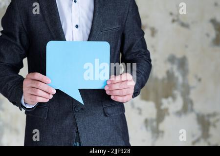 man hold blue speech bubble social media business Stock Photo