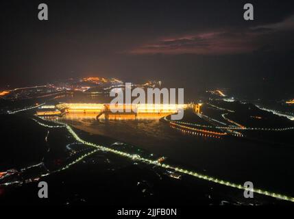 YICHANG, CHINA - JULY 25, 2022 - An aerial photo shows the night view of the Three Gorges Dam in Yichang, Hubei province, China, July 25, 2022. In 201 Stock Photo