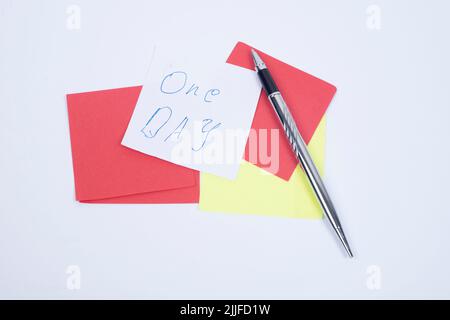 Blank Sticky Note With Laundry Clip Stack Of Colorful Paper Pen Placed On Table. Stock Photo