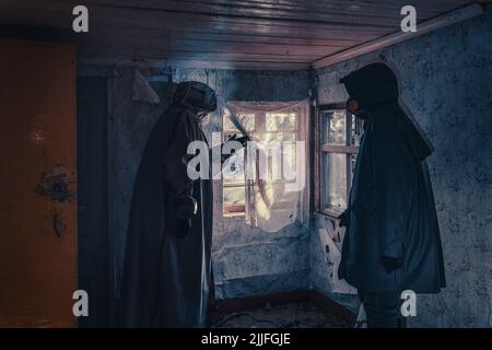 Fictional movie poster. People with flashlights, masks and protective clothing inspect old house. Infected epidemic people in destroyed home. Dark gloomy environment, filter processing.  Stock Photo