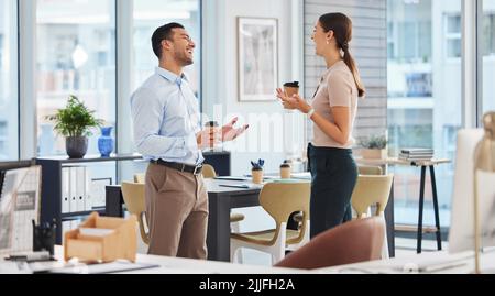 Im so glad that we could catch up. two business colleagues talking while enjoying coffee. Stock Photo