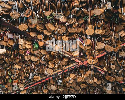 Close shot of lovers' padlocks (love locks) on a bridge over the Seine River in Paris, France. Stock Photo