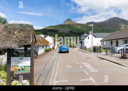 Glencoe Folk Museum housed in an 18th century thatched property in Glencoe Village,Highlands of Scotland,Scotland,Uk on summers day with Pap Glencoe Stock Photo