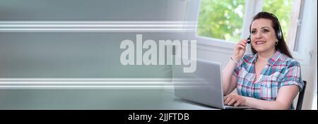 Young beautiful woman with headset working from home; panoramic banner Stock Photo