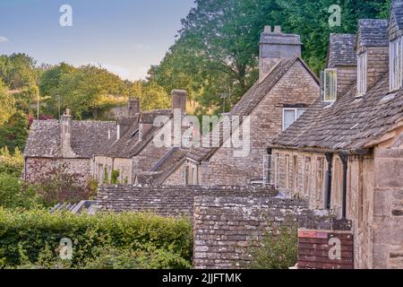 Traditional stone clad roofs on Cotswold cottages in Bisley Stock Photo