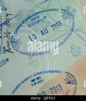 Passport immigration visa stamps entering en exiting Stock Photo