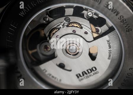 St. Petersburg, Russia - November 11, 2021: Transparent case back of self-winding mechanic Swiss watch. Rado Automatic Open Heart 734.0510.3 Stock Photo