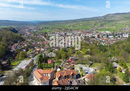 An aerial view of Sovata resort surrounded by buildings and trees in Romania Stock Photo