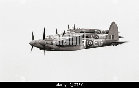 Three De Havilland Mosquito FB Mark VI Series 2s of No. 487 Squadron RNZAF based at Hunsdon, Hertfordshire, flying in tight starboard echelon formation, with 500-lb MC bombs on fitted on underwing carriers. The 'Wooden Wonder' or 'Mossie' was a British twin-engined, shoulder-winged, multirole combat aircraft, introduced during the Second World War. Unusual in that its frame was constructed mostly of wood. Stock Photo