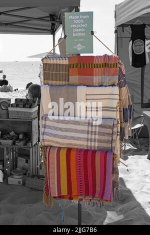 items made from 100% recycled plastic bottles for sale on Dorset ECO stall at event in Poole, Dorset UK in July Stock Photo