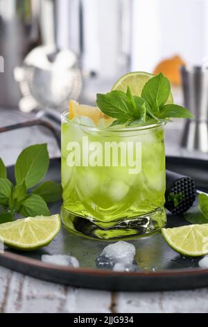 Thai basil smash cocktail and lemon. Refreshing organic gin drink