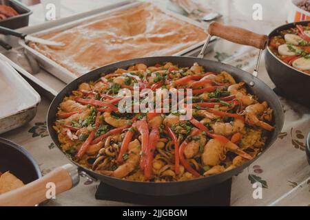 Big Wok Pan of Spanish Seafood Paella with Mussels, Shrimps and Vegetables  Stock Image - Image of fresh, green: 157899027