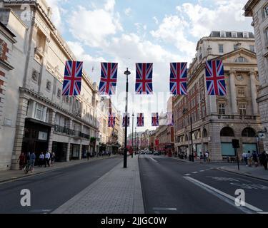 London, Greater London, England, June 15 2022: Union Jacks hanging overhead along Piccadilly Stock Photo