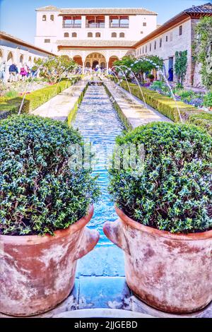 The Patio de la Acequia in the Generalife - Water garden with fountains at the Alhambra palace and fortress in Granada, Andalusia, Spain Stock Photo