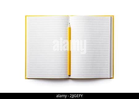 Empty notebook and yellow pencil isolated on white background Stock Photo