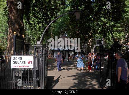 Gateway to summer crowds in Soho square park , Soho - Entertainment District, London, England, UK, W1D 3QN Stock Photo