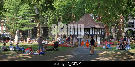Summer crowds in Soho square park , Soho - Entertainment District, London, England, UK, W1D 3QN Stock Photo