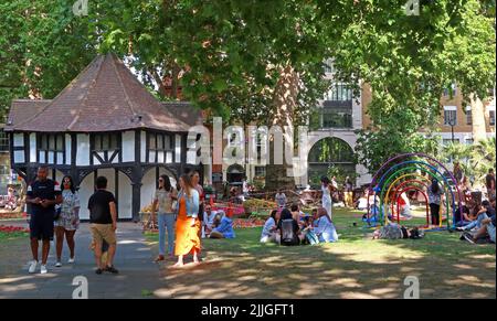 Summer crowds in Soho square park , Soho - Entertainment District, London, England, UK, W1D 3QN Stock Photo