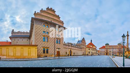 Panorama with elegant Schwarzenberg Palace, decorated with sculptured gabled roof and sgraffito ornament, St Benedict Church of Carmel of St Joseph an Stock Photo