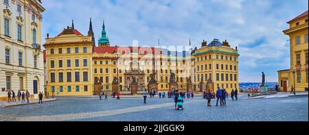 PRAGUE, CAZECH REPUBLIC - MARCH 6, 2022: Panorama of Castle Square with historic New Royal Palace with sculptured Entrance Gate in front of it, on Mar Stock Photo