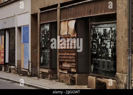 Sebnitz, Germany, July 6, 2022: Abandoned and barricaded store with sheep windows in a suburb Stock Photo