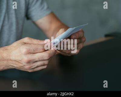 business correspondence man opening letter Stock Photo