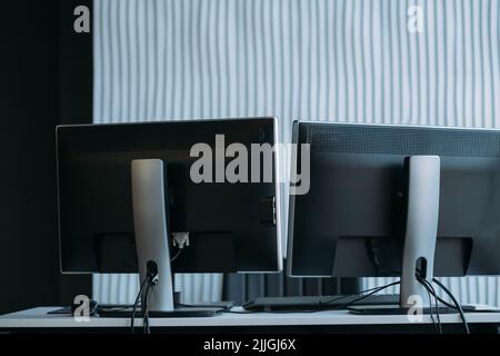 software developer workplace two monitors office Stock Photo