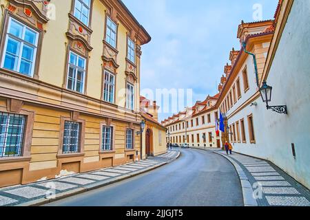 The curved Valdstejnska Street in Lesser Quarter between historic buildings of Kolowrat and Wallenstein Palaces, Prague, Czech Republic Stock Photo