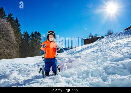 Boy at ski school three years old child in snow over mountains Stock Photo
