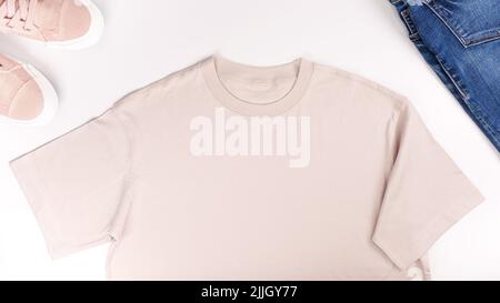 Blank beige t-shirt mockup front and back isolated on white